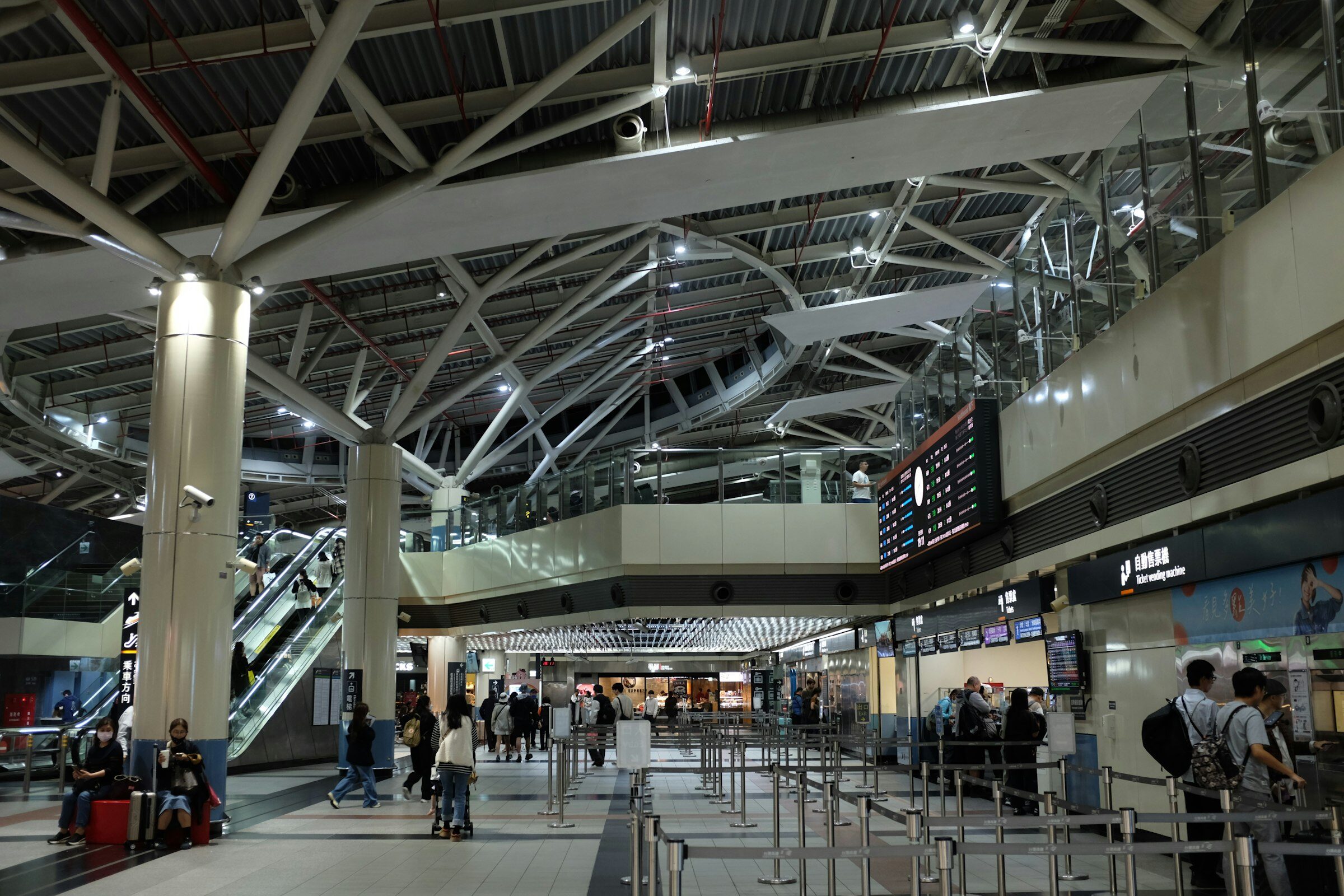 Traveller checking the departures board at an airport