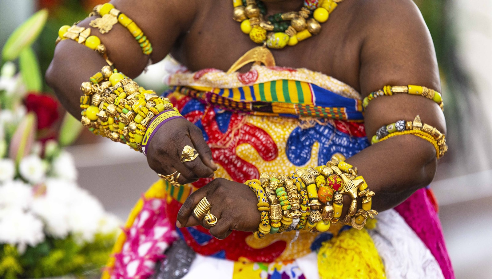 Performer in colourful costume at a cultural festival in Kumasi, Ghana